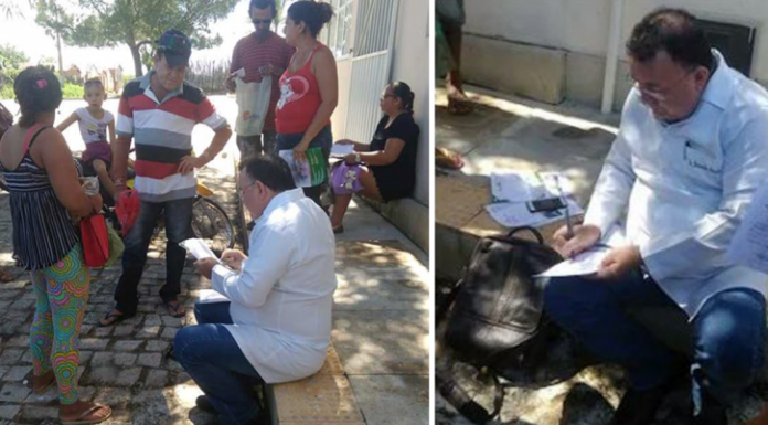 Com posto de saúde fechado, médico atende pacientes na calçada